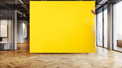 Girl hands keep rolling pin with flour on yellow background. Bake menu, recipe, homemade pastry concept. Top view. Banner with copy space for your text Wall mural