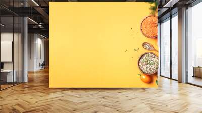 Organic vegetables, lentils, beans, raw ingredients for cooking on trendy yellow background. Healthy, clean eating concept. Vegan or gluten free diet. Copy space. Top view. Food frame Wall mural