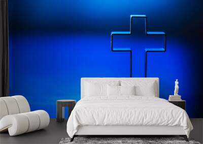 Silhouette of christian cross on blue background, soft bokeh lights background. Copy space. Church worship, salvation concept. Faith symbol in Jesus Christ. Holy cross for Christmas, Easter day Wall mural