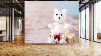 Shiny white Christmas balls and white cute bear over snow backgr Wall mural