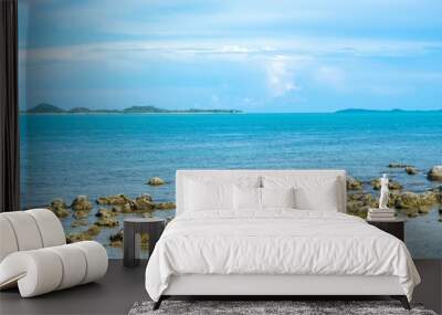 Seascape view under cloudy blue sky Wall mural