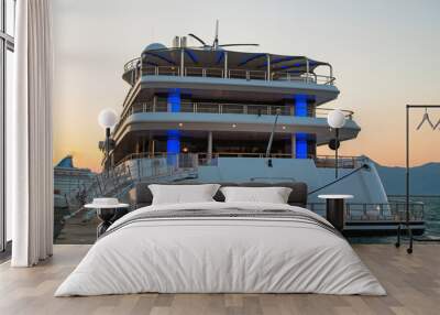 Sunset: Luxury large super or mega motor yacht in the evening. Wall mural