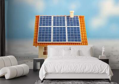 Miniature house with solar panels on the roof, symbolizing sustainable energy and eco-friendly living. Wall mural