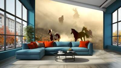 Sunlight Horses and cowboy galloping and through the desert Wall mural