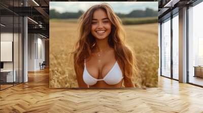 Beautiful woman smiling and posing in wheat field Wall mural