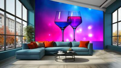 Two elegant wineglasses filled with colorful cocktails on a festive background Wall mural