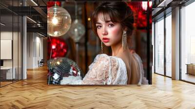 Young brunette woman in elegant white lace dress with disco balls. Trendy makeup Wall mural