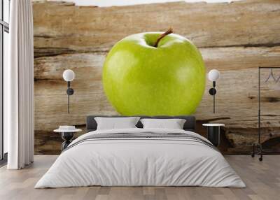 one green apple on wood background Wall mural