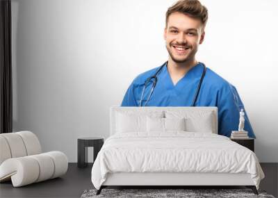 profession and medicine concept - happy smiling doctor or male nurse in blue uniform
.isolated on white background Wall mural