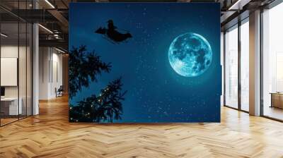 Santa Claus's silhouette against a moonlit sky, as he flies through the night on Christmas Eve.   Wall mural