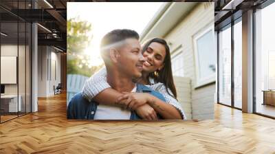 I love you. Cropped shot of an affectionate young couple chilling outside on their patio in the yard. Wall mural