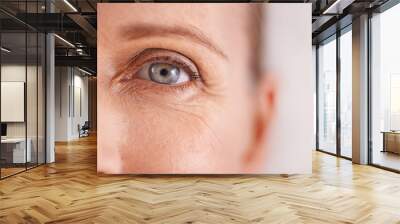 The fight against wrinkles. Closeup studio shot of a beautiful mature womans face. Wall mural