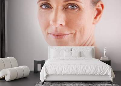 You can tell she loves her skin. Cropped studio shot of a beautiful mature woman looking over her shoulder. Wall mural