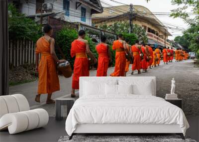 Buddhist monks in a line in Luang Prabang, Laos Wall mural