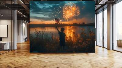 July 4th - Independence Day celebration - young boy waving an American flag while watching fireworks over a lake - natural light - patriotism  Wall mural