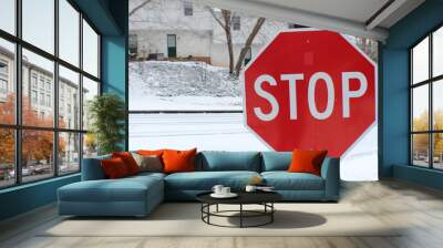 Stop sign on icy road Wall mural