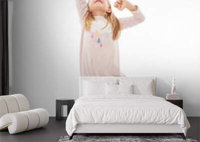  Cute girl trying to catch something, isolated on white background Wall mural