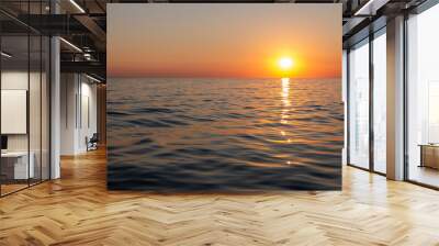 The gorgeous golden sun descends towards the horizon, casting a warm and mesmerizing glow over the tranquil waves of the ocean, creating a breathtaking and serene scene. Wall mural