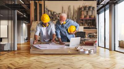 Two architects discussing blueprint Wall mural