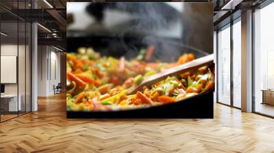 Cooking carrot, pumpkin, zucchini nad leek in wok. Selective focus, close-up. Wall mural