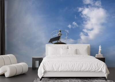 Solar powered lightouse. Dramatic sky in the background.  Wall mural