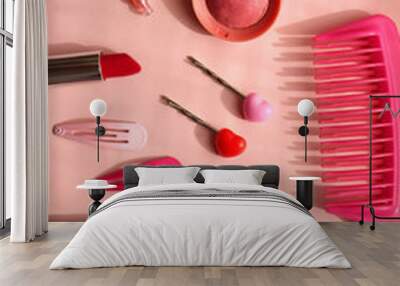 Various pink accessories and make up products on bright pink background. Flat lay. Wall mural