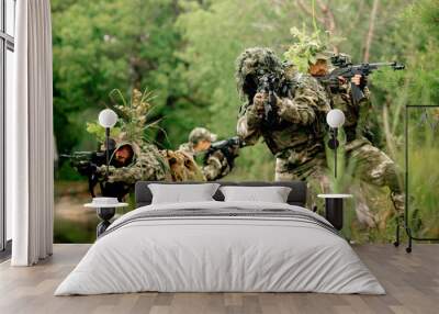 Soldiers in a combat situation. Men play airsoft. Wall mural