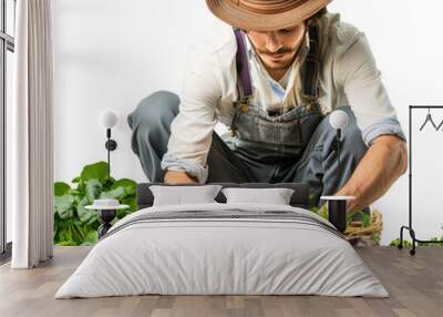 A young farmer collects vegetables in a small garden, on a transparent background Wall mural