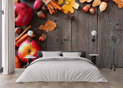 Autumn corner border of apples and fall ingredients on a rustic wood background with copy space Wall mural