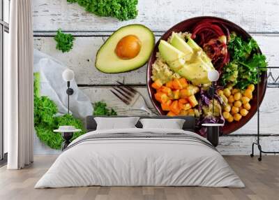 Buddha bowl with quinoa, avocado, chickpeas, vegetables on a white wood background, Healthy food concept. Top view. Wall mural