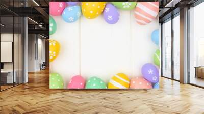 Colorful pastel Easter Egg frame against a white wood background. Top view with copy space. Wall mural