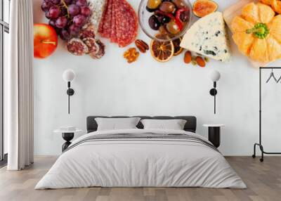 Fall charcuterie top border against a white marble banner background. Assorted cheese and meat appetizers. Copy space. Wall mural