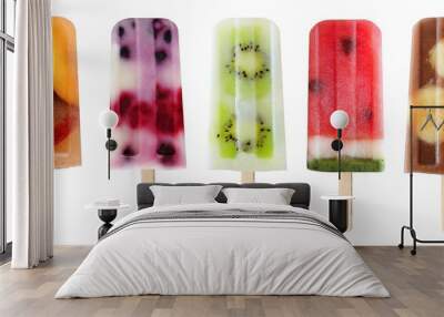 Five assorted fruit popsicles isolated on a white background Wall mural