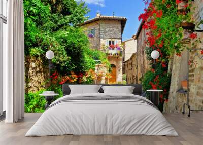 Flower filled medieval street in the beautiful old town of Assisi, Italy Wall mural