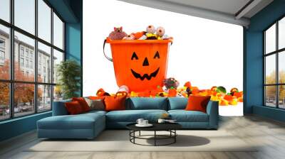 Halloween Jack o Lantern candy collector with a pile of candy over a white background Wall mural