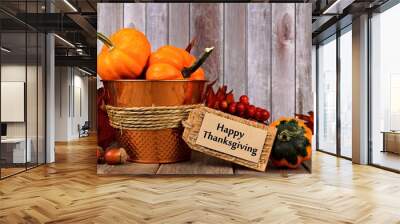 Happy Thanksgiving tag, pumpkins, leaves and autumn home decor with rustic wood background Wall mural