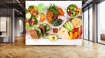 healthy lunch table scene with nutritious lettuce wraps, buddha bowl, vegetables, sandwiches, and sa Wall mural