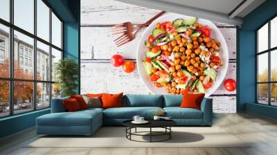 Healthy Mediterranean salad with chick peas. Top view table scene over a rustic white wood background. Wall mural