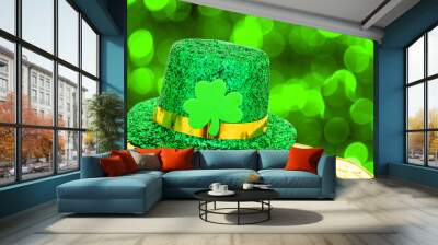 St Patricks Day hat and gold coins on green background Wall mural