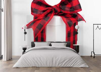 White Christmas gift box with black and red buffalo plaid bow and ribbon. Side view isolated on a white background. Wall mural