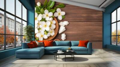 Fresh white flowers arranged on wooden background with natural elements. Wall mural