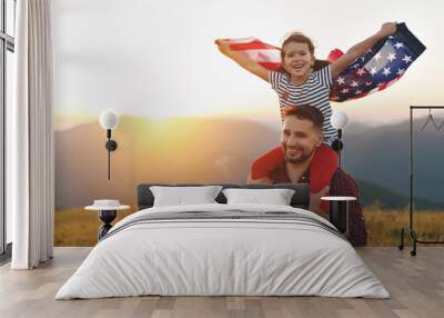  happy family father and child with flag of united states enjoying sunset on nature
 Wall mural