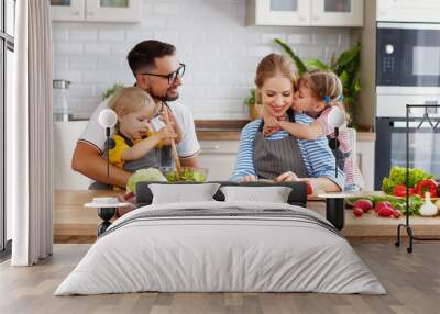 appy family with child  preparing vegetable salad Wall mural