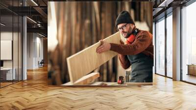 brutal male carpenter working in  workshop Wall mural