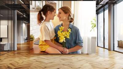 child daughter   gives mother   bouquet of flowers to narcissus Wall mural