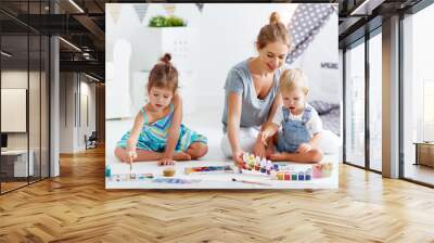 children's creativity. mother and children draw paints in   playroom Wall mural