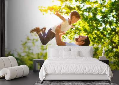 concept of father's day! happy family dad and child daughter    in nature. Wall mural