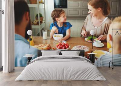 family mother father and children have Breakfast in kitchen in morning. Wall mural