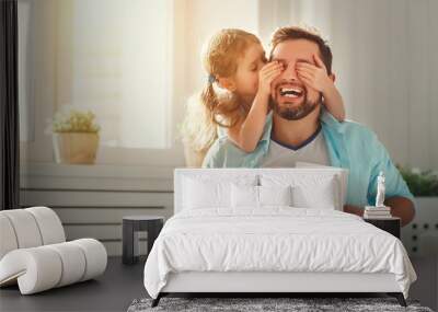 Father's day. Happy family daughter hugging dad and laughs Wall mural