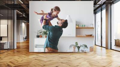 Father's day. Happy family daughter hugs his dad Wall mural